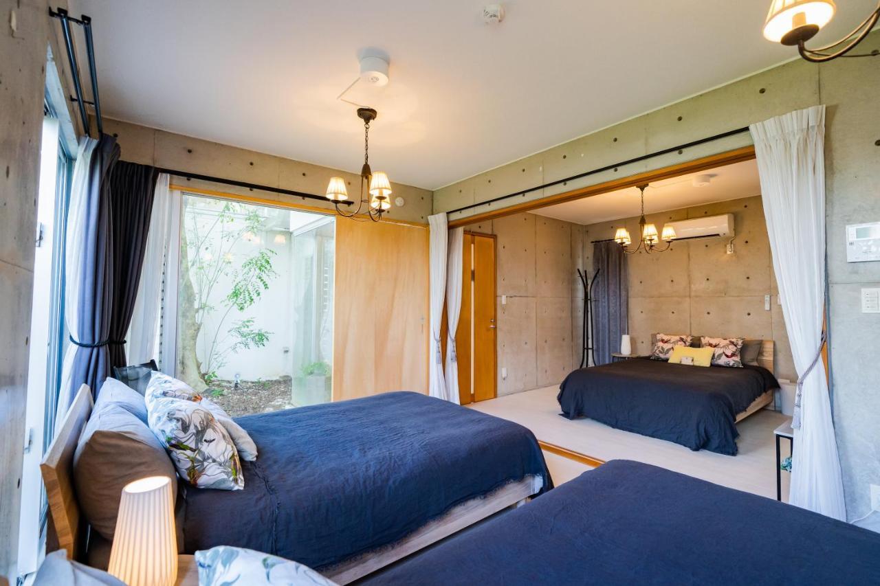 Em Tree House Villa Uruma Exterior photo